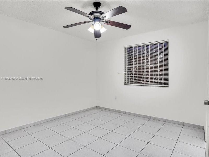 8990 Southwest 24th Street, Unit 33 Miami, FL 33165 - Photo 9 of 22 a view of an empty room with a window