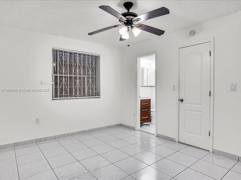 8990 Southwest 24th Street, Unit 33 Miami, FL 33165 - Photo 10 of 22 a view of an empty room with a window
