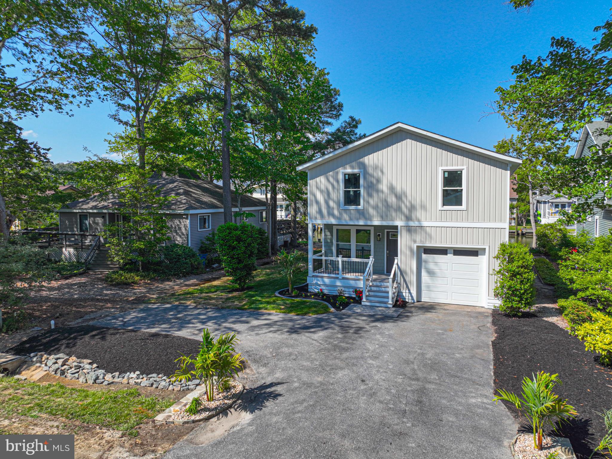 8 Grand Port Road Ocean Pines, MD 21811 - Photo 5 of 18 a view of a house with a yard and potted plants