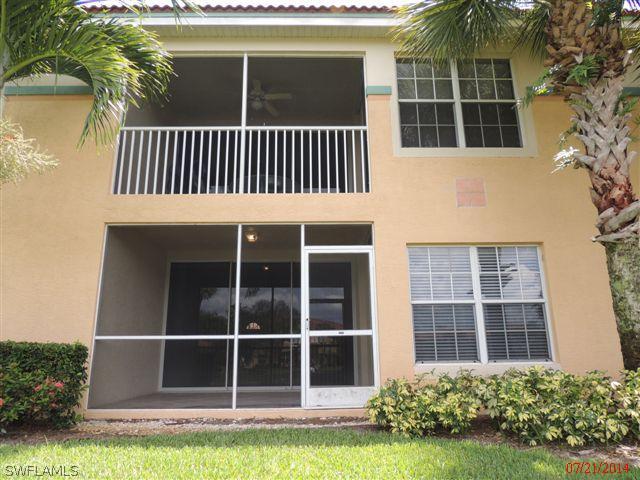 23891 Costa Del Sol Road, Unit 103 Bonita Springs, FL 34135 - Photo 12 of 12 a view of a house with a yard