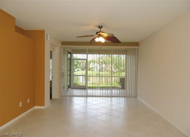 23891 Costa Del Sol Road, Unit 103 Bonita Springs, FL 34135 - Photo 5 of 12 a window in an empty room