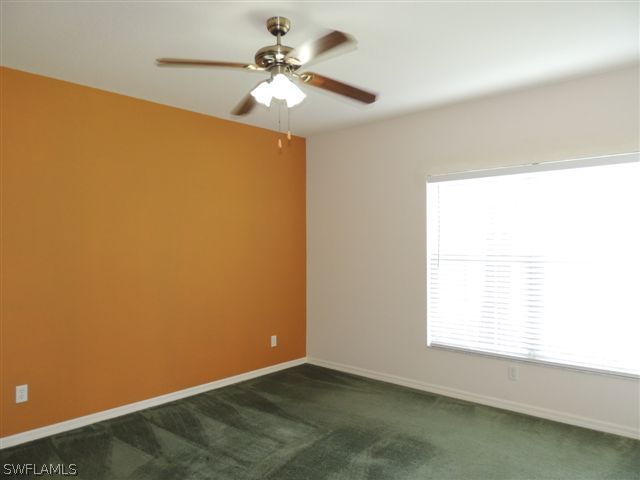 23891 Costa Del Sol Road, Unit 103 Bonita Springs, FL 34135 - Photo 6 of 12 an empty room with a window