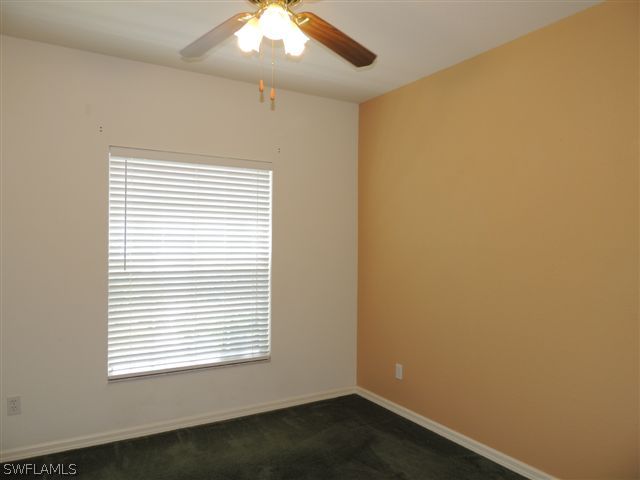 23891 Costa Del Sol Road, Unit 103 Bonita Springs, FL 34135 - Photo 8 of 12 an empty room with a window