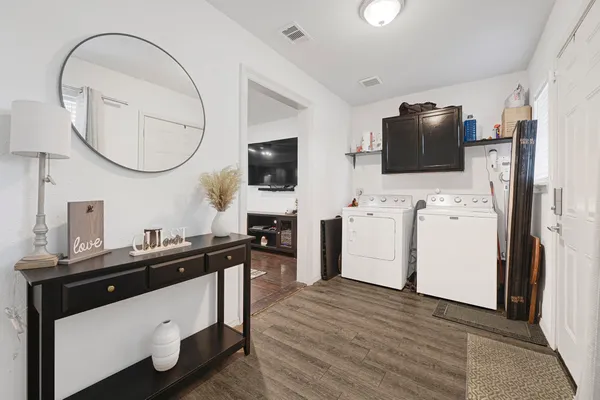 a kitchen with a sink appliances and cabinets