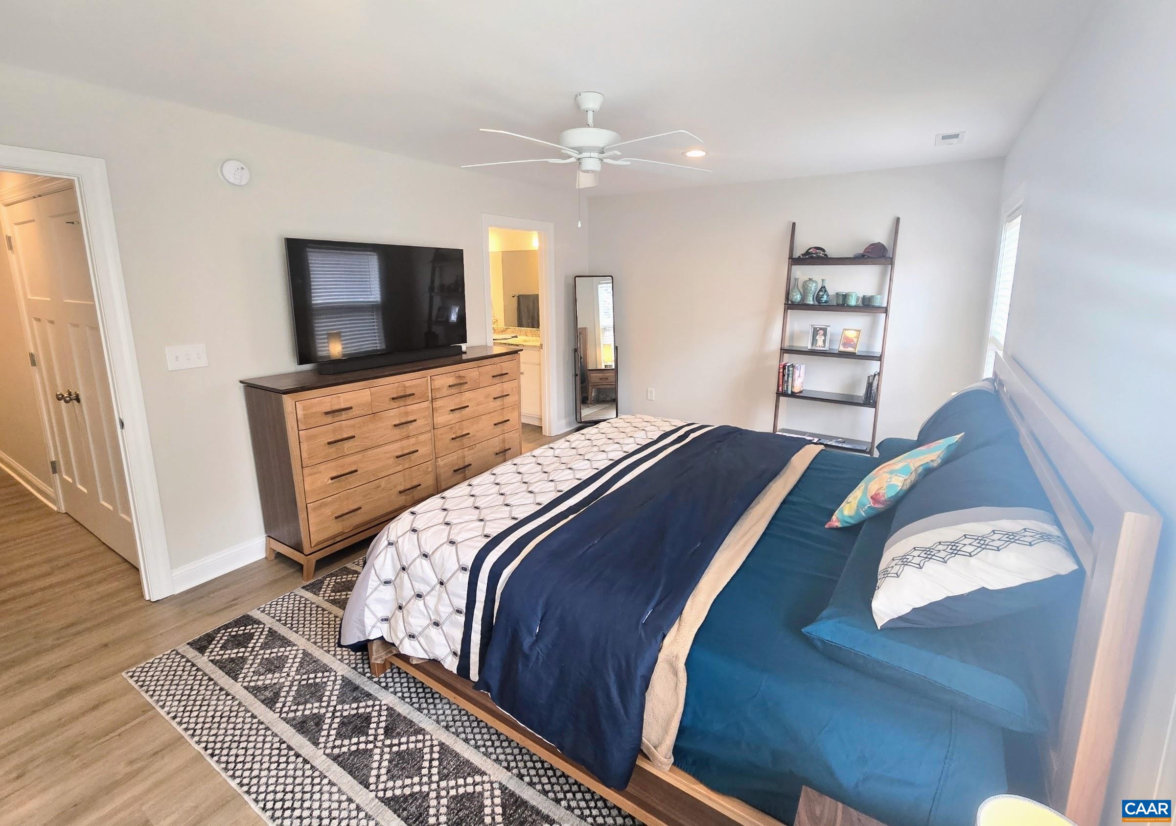 104 Blithe Court Charlottesville, VA 22901 - Photo 7 of 11 a bedroom with a bed and a flat screen tv