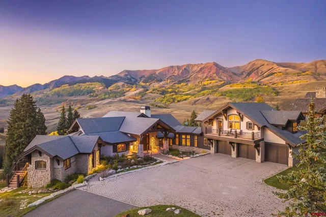an aerial view of residential houses and a road