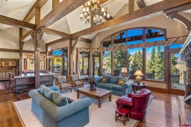 a living room with furniture ceiling fan and a rug
