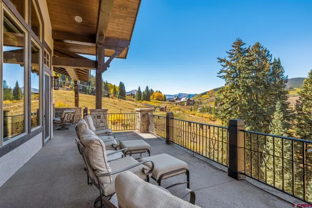 a view of a balcony with chairs