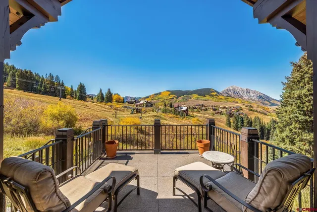 a view of a chairs and table on the terrace