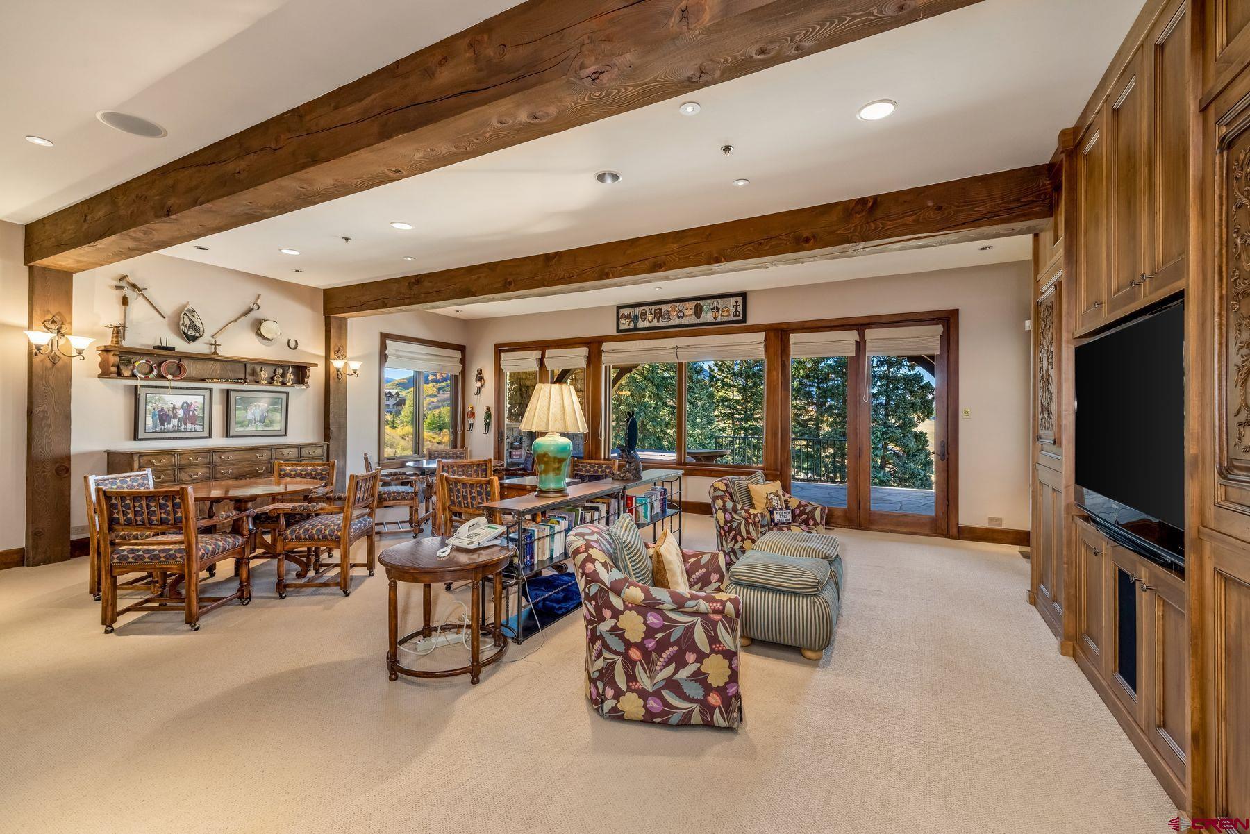 28 Kokanee Lane Crested Butte, CO 81225 - Photo 33 of 45 a living room with furniture tv and a large window