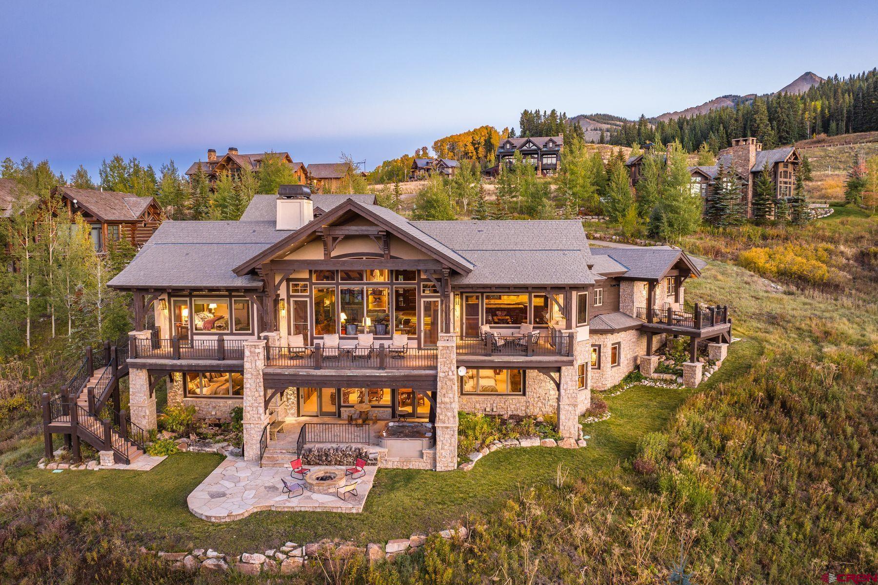 28 Kokanee Lane Crested Butte, CO 81225 - Photo 36 of 45 a view of a big house with a big yard and large trees