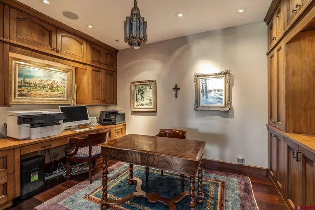 a spacious bedroom with two beds and a large window