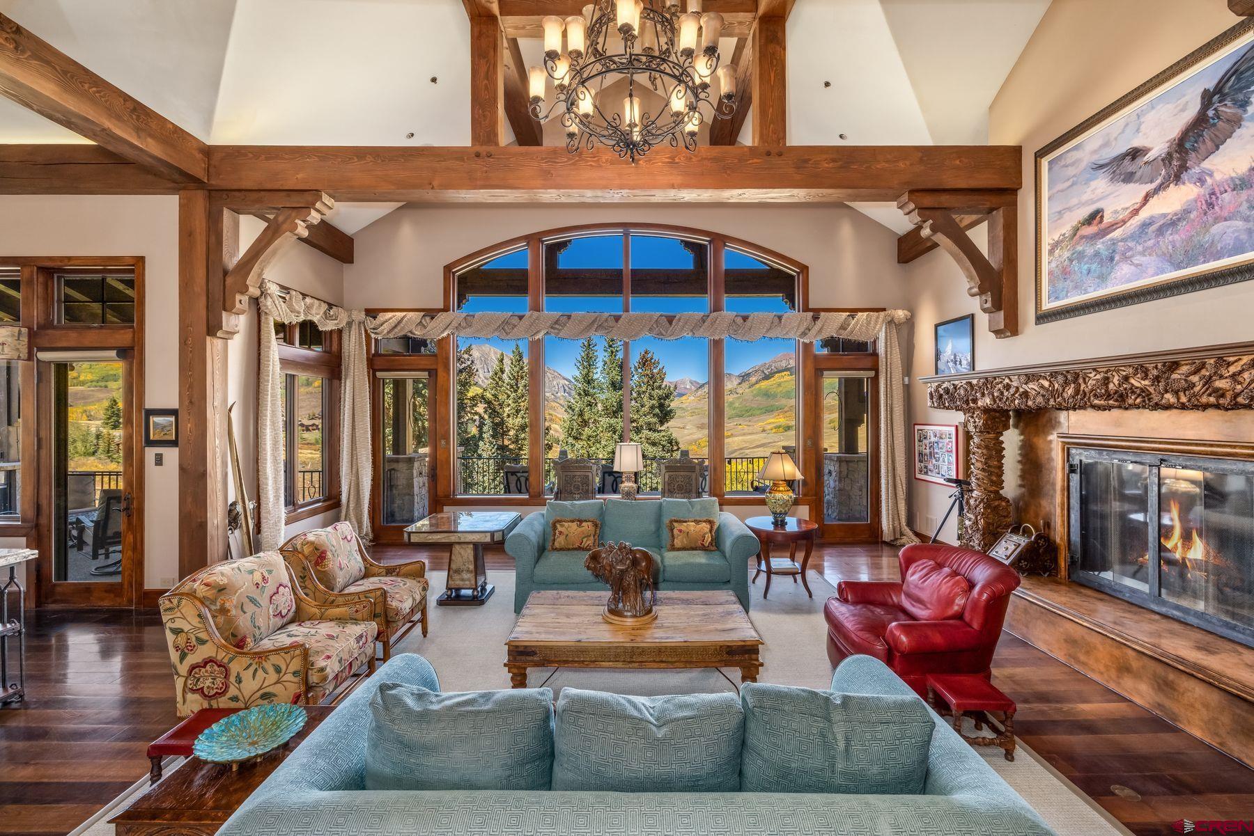 28 Kokanee Lane Crested Butte, CO 81225 - Photo 4 of 45 a outdoor living area with patio furniture and a fireplace