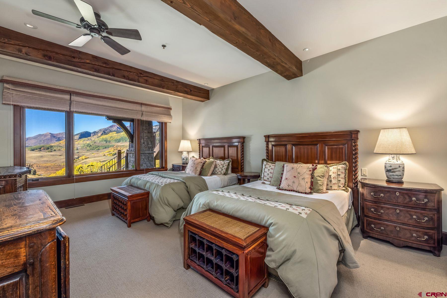 28 Kokanee Lane Crested Butte, CO 81225 - Photo 41 of 45 a bedroom with two beds and a large window
