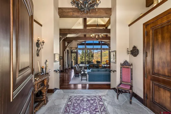 a living room with furniture rug and window