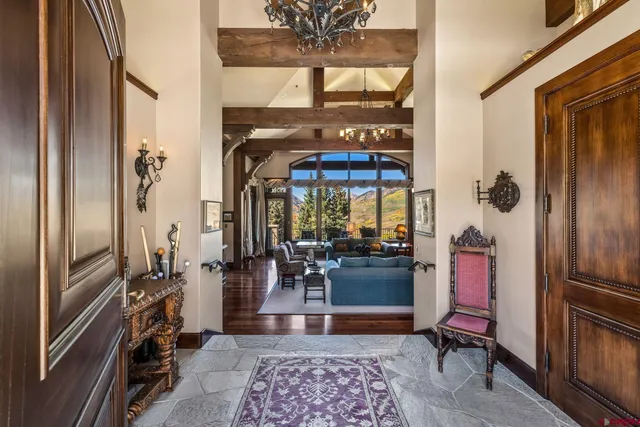a living room with furniture rug and window