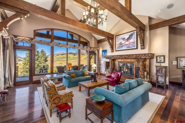 a living room with furniture fireplace and flat screen tv