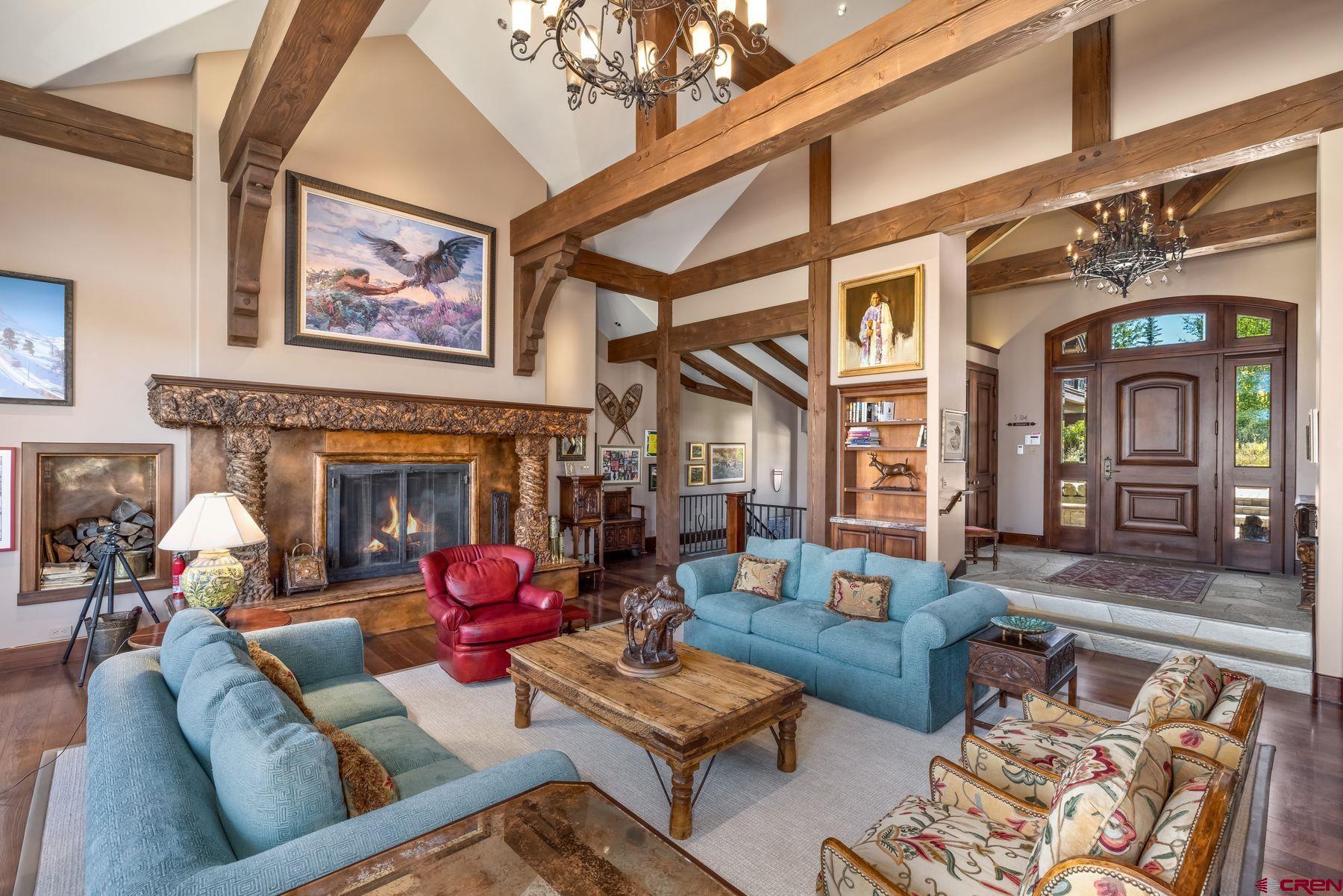 28 Kokanee Lane Crested Butte, CO 81225 - Photo 10 of 45 a living room with furniture fireplace and a window