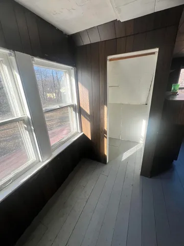 a view of entryway with wooden floor