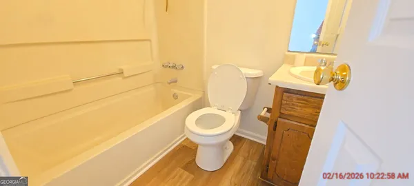 a bathroom with a sink toilet and bathtub
