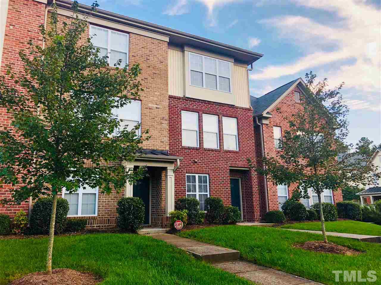 2133 Kedvale Avenue Raleigh, NC 27617 - Photo 2 of 25 a front view of a house with a yard and trees