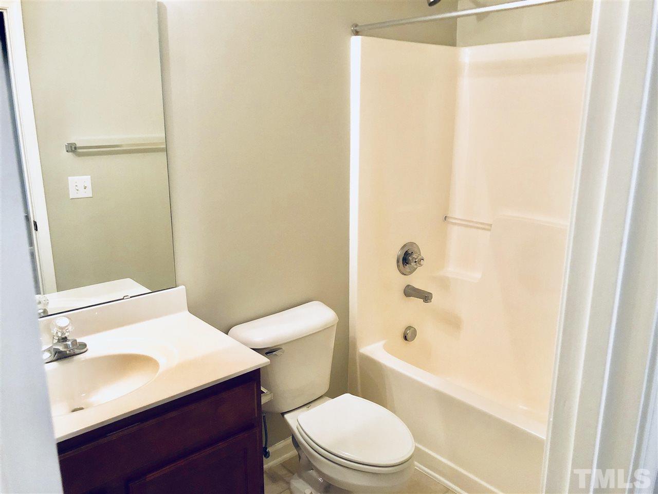 2133 Kedvale Avenue Raleigh, NC 27617 - Photo 12 of 25 a bathroom with a sink a toilet and shower
