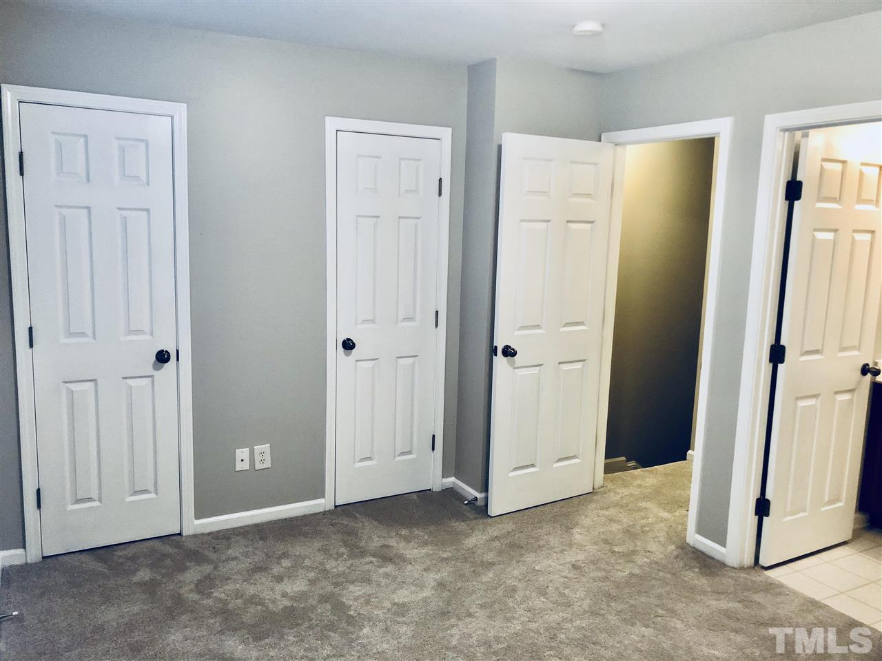 2133 Kedvale Avenue Raleigh, NC 27617 - Photo 13 of 25 an empty room with windows and a ceiling fan