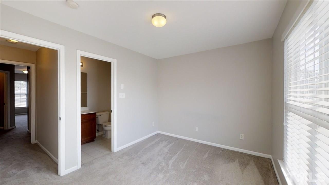 2133 Kedvale Avenue Raleigh, NC 27617 - Photo 14 of 25 an empty room with windows and closet
