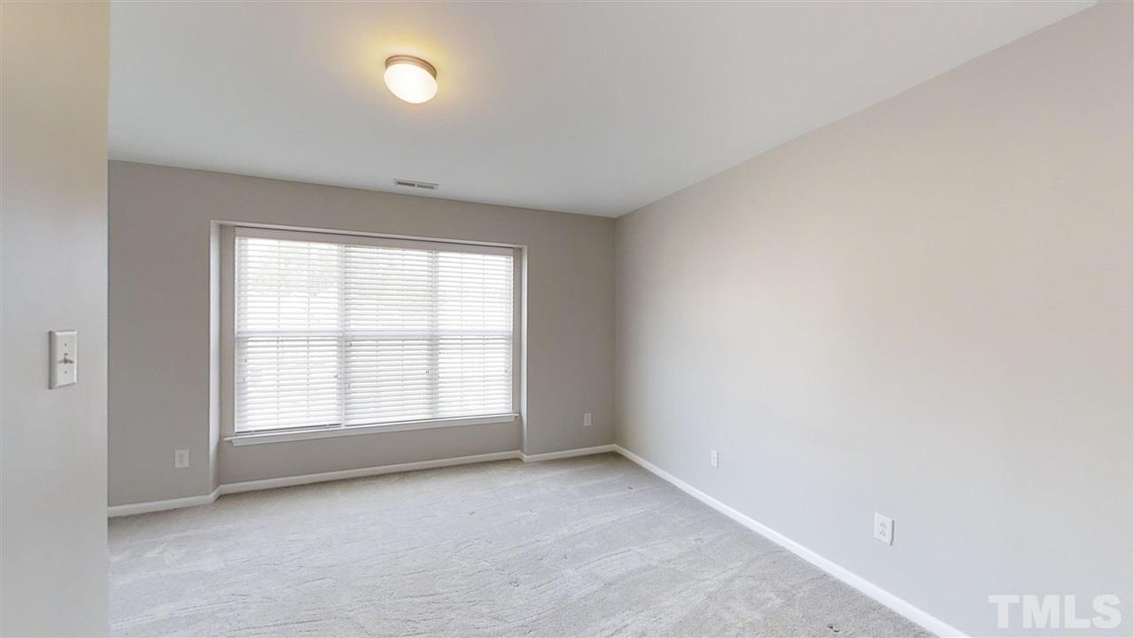 2133 Kedvale Avenue Raleigh, NC 27617 - Photo 17 of 25 an empty room with a window