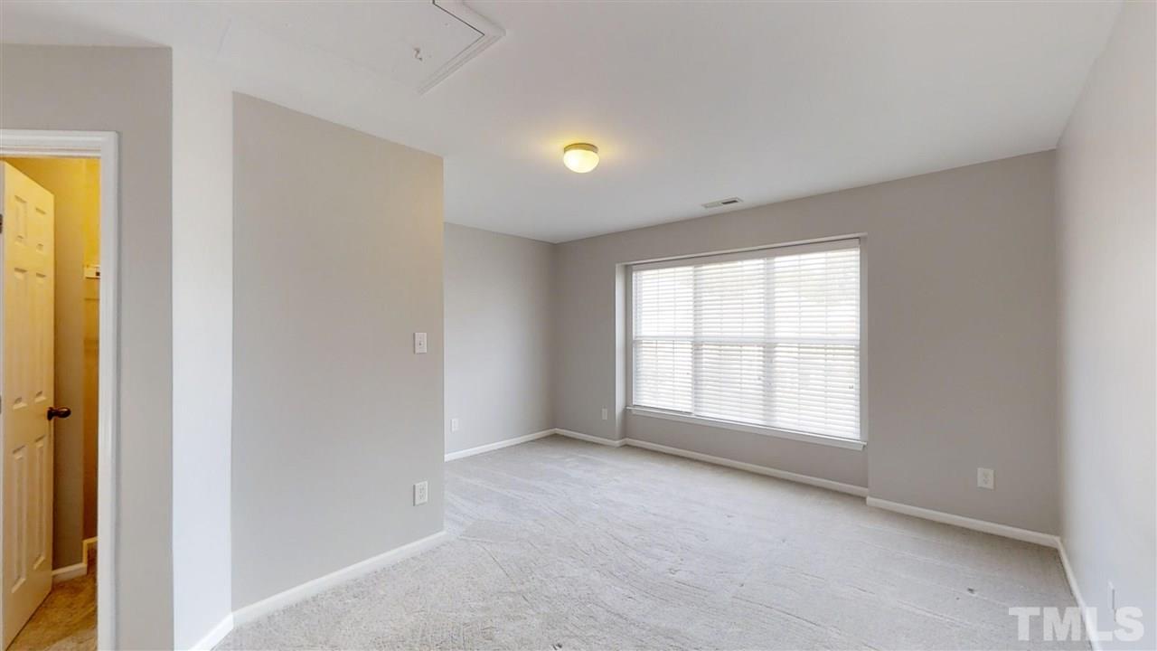 2133 Kedvale Avenue Raleigh, NC 27617 - Photo 18 of 25 a view of an empty room with a window