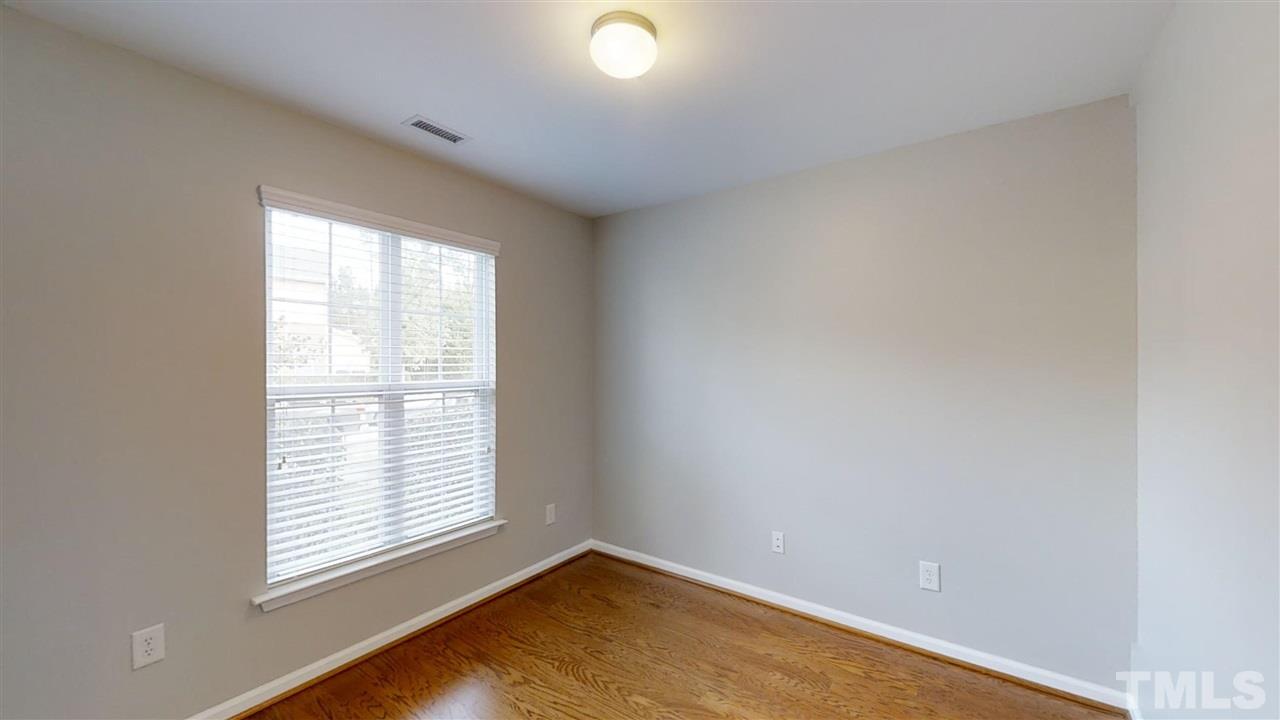 2133 Kedvale Avenue Raleigh, NC 27617 - Photo 4 of 25 an empty room with a window