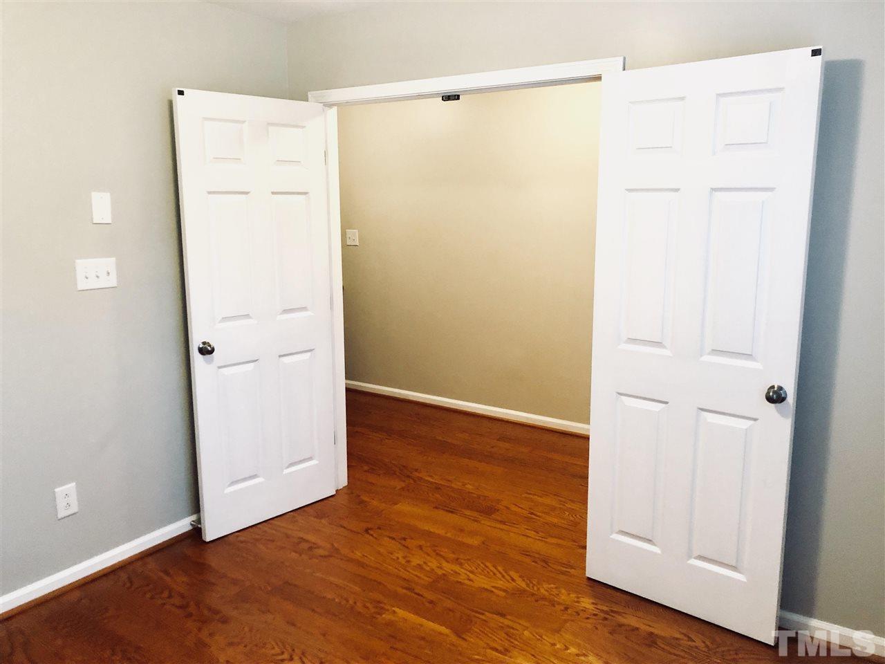 2133 Kedvale Avenue Raleigh, NC 27617 - Photo 5 of 25 an empty room with wooden floor