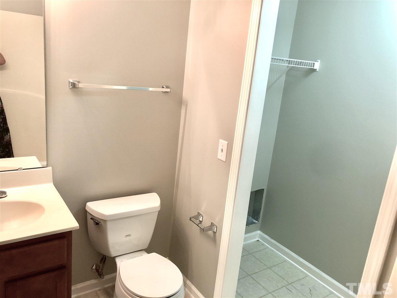 2133 Kedvale Avenue Raleigh, NC 27617 - Photo 6 of 25 a white toilet sitting next to a shower