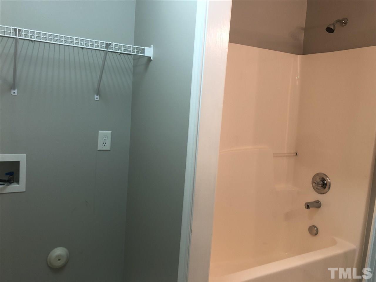 2133 Kedvale Avenue Raleigh, NC 27617 - Photo 7 of 25 a bathroom with a shower and a tub
