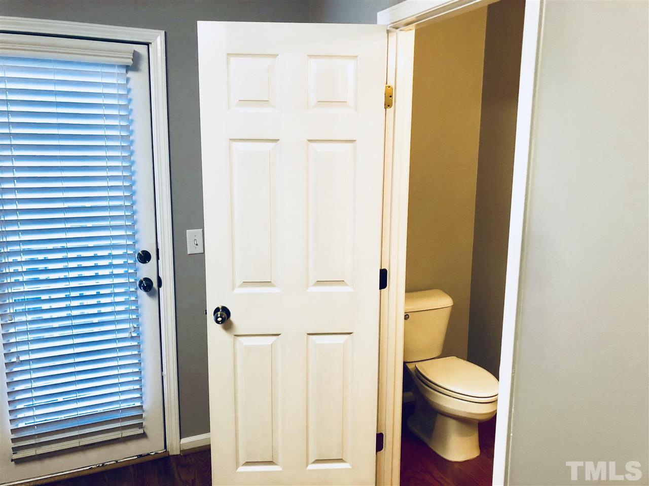2133 Kedvale Avenue Raleigh, NC 27617 - Photo 9 of 25 a white toilet sitting next to a bathroom sink