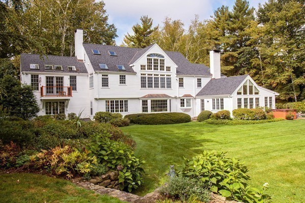 89 Black Oak Road Weston, MA 02493 - Photo 11 of 14 a front view of a house with a garden