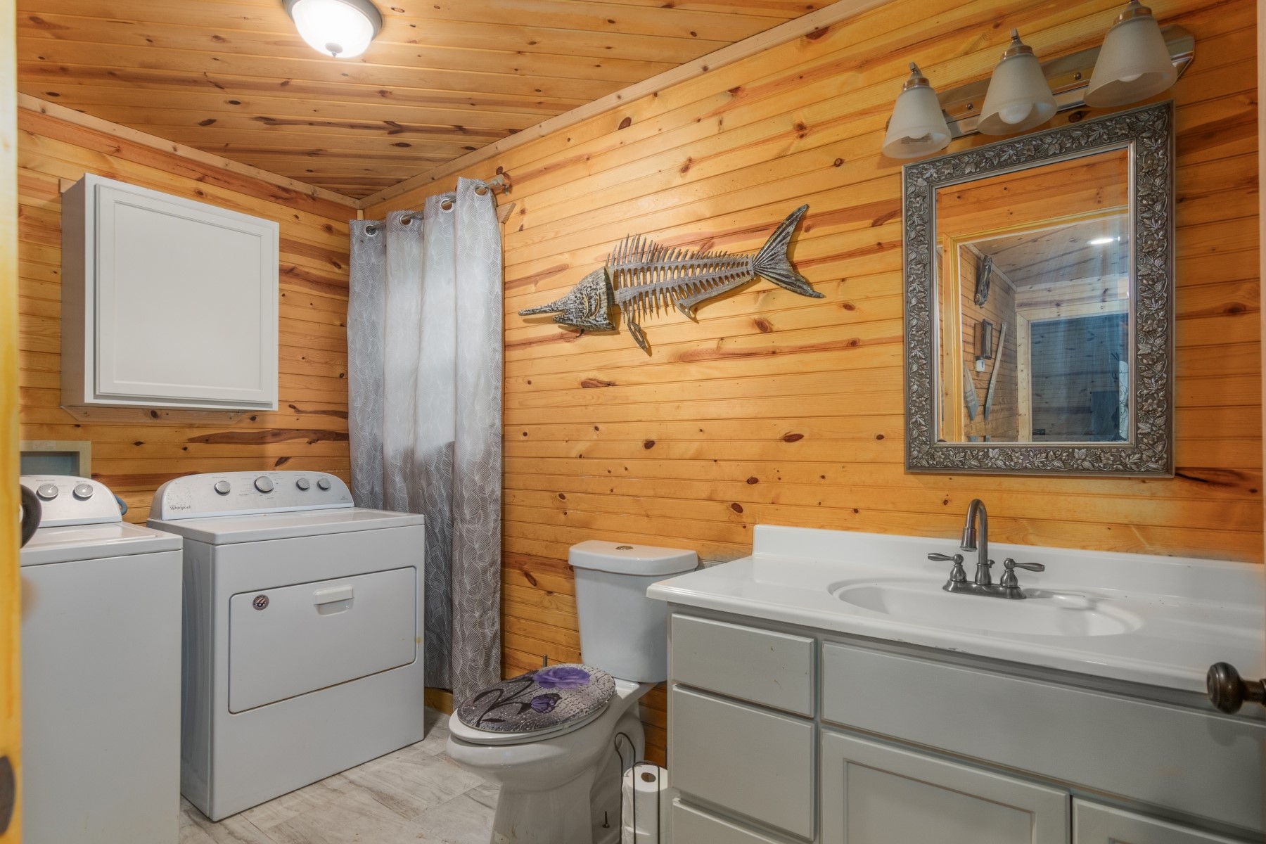 134 Magnolia Point Drive Houston, TX 77336 - Photo 12 of 31 a bathroom with a sink a toilet and mirror
