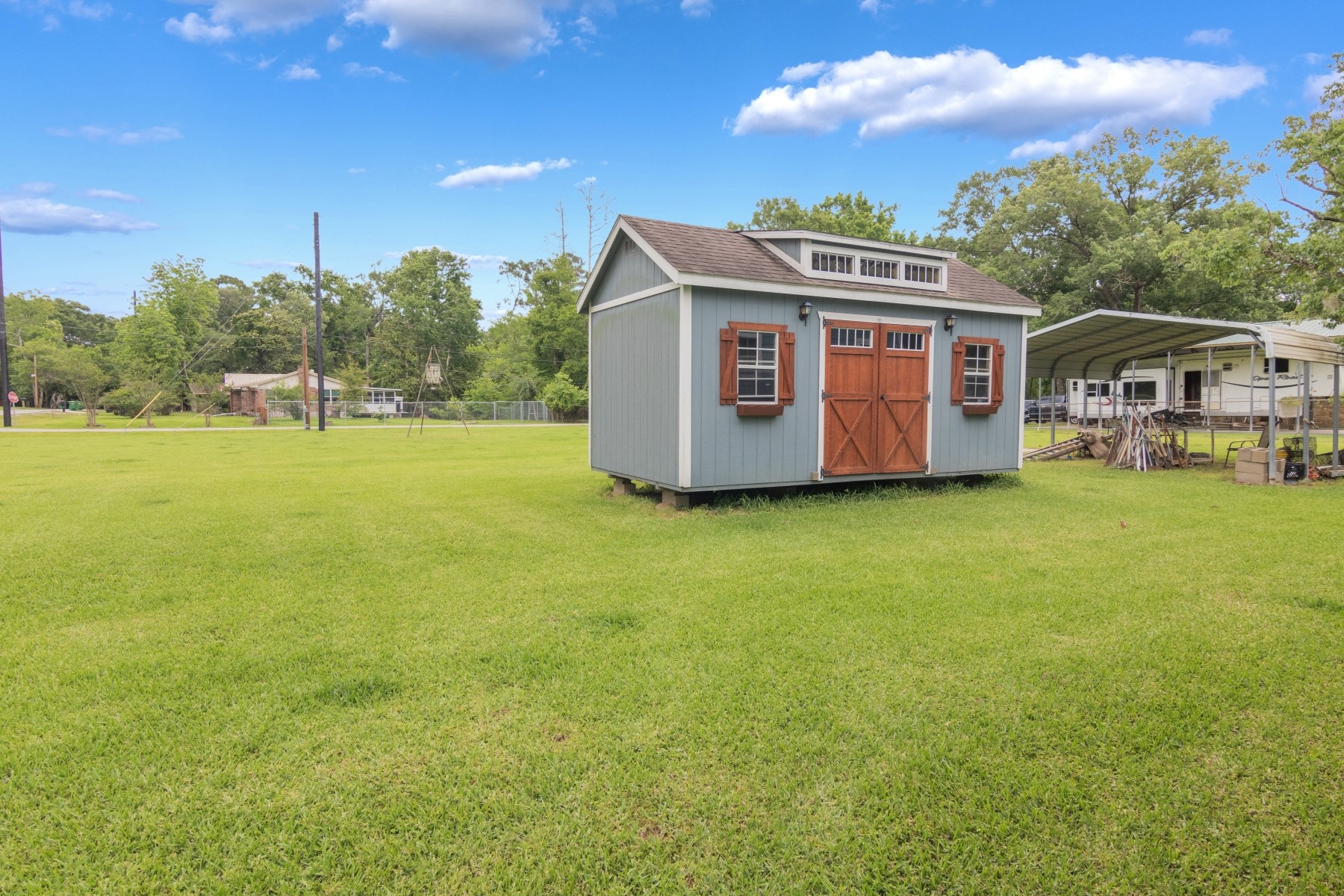 134 Magnolia Point Drive Houston, TX 77336 - Photo 19 of 31 a view of a big house with a big yard and large trees