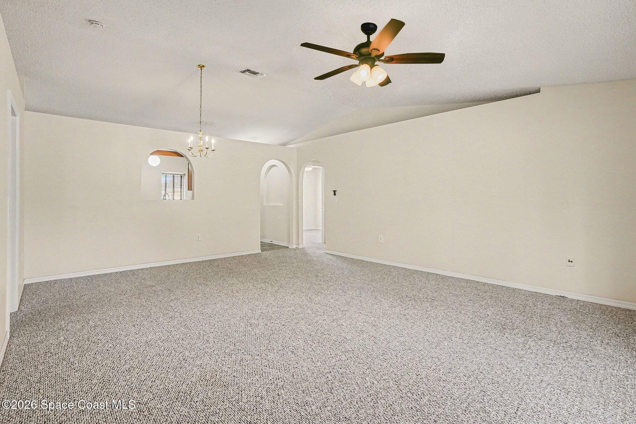 2268 Spring Creek Circle Palm Bay, FL 32905 - Photo 3 of 23 a view of a big room with carpet