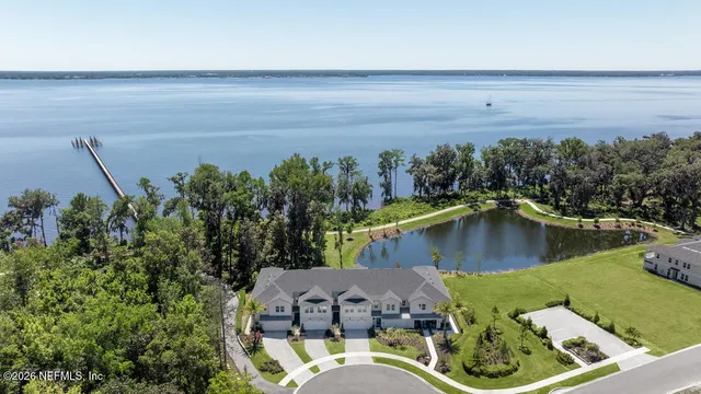 a view of a swimming pool with a yard