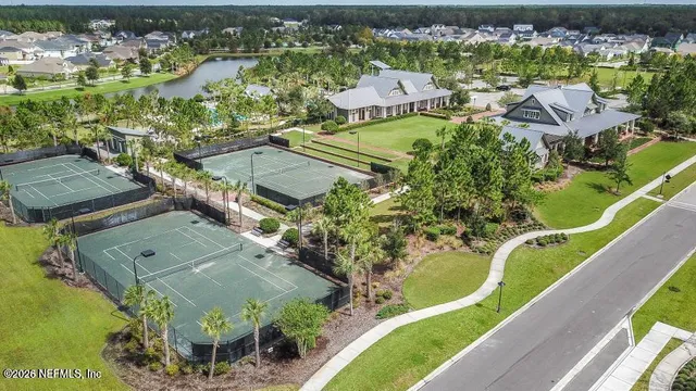 an aerial view of a house with a swimming pool