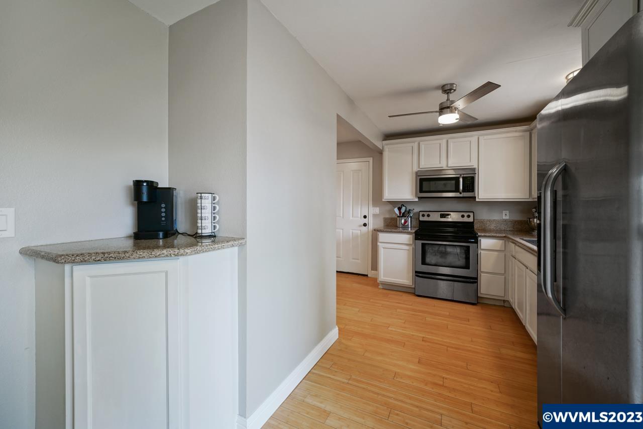 3039 Pringle Road Southeast Salem, OR 97302 - Photo 13 of 29 a kitchen with stainless steel appliances a refrigerator stove and microwave