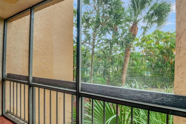 a view of outdoor space with green trees