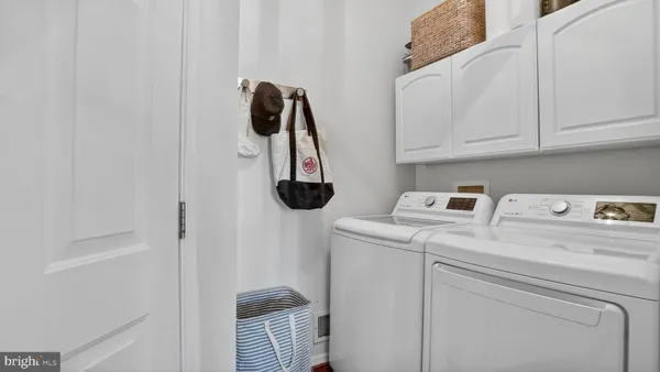 a bathroom with a granite countertop sink and a bathtub