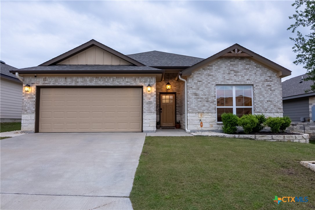 7909 McCulloch Road Temple, TX 76502 - Photo 45 of 46 a front view of a house with a yard and garage