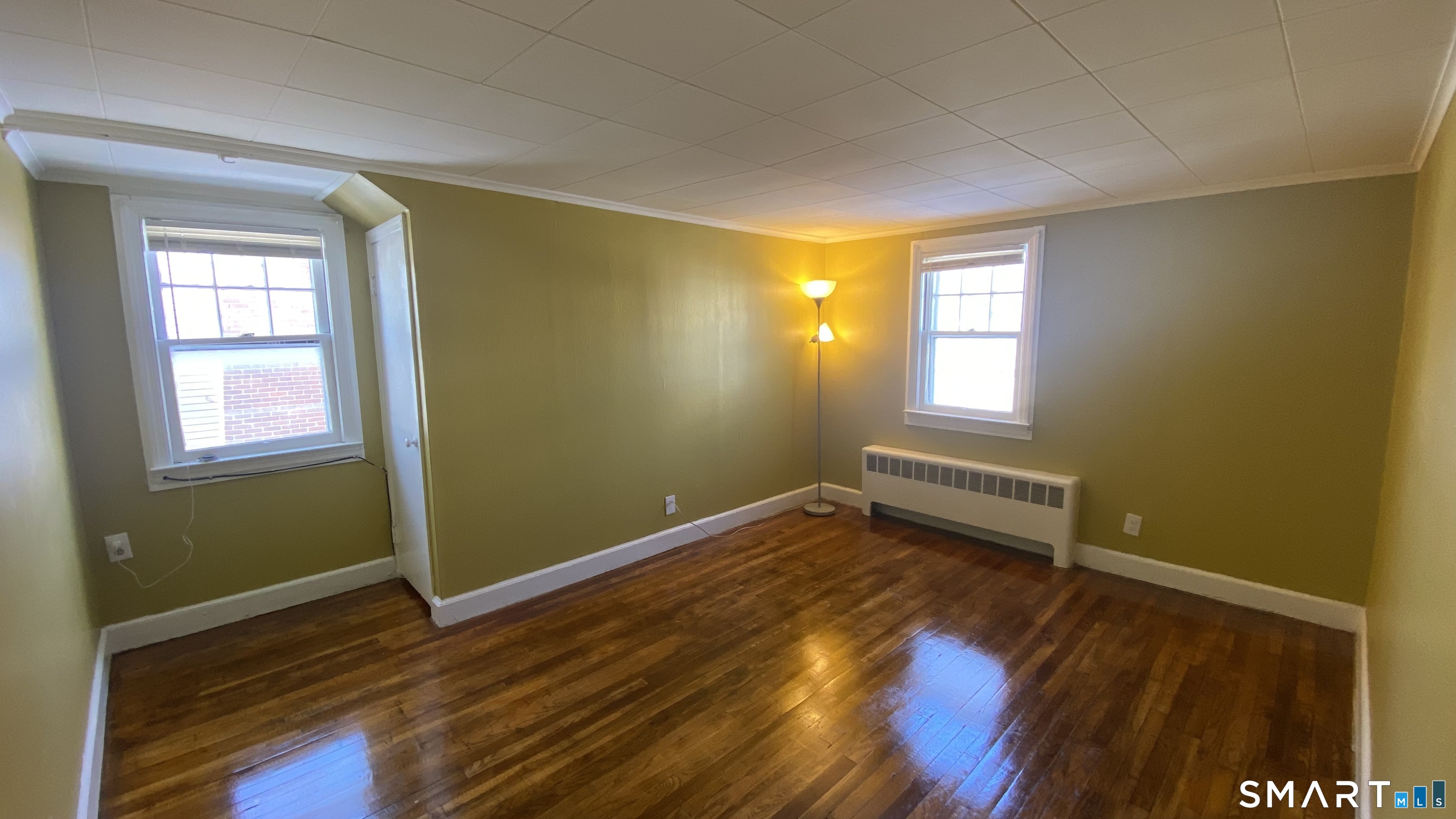 214 Columbia Street, Unit 2 New Britain, CT 06052 - Photo 13 of 31 a view of room with window and wooden floor
