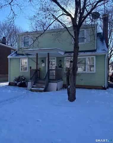 a view of a chairs and fire pit in the middle of a building