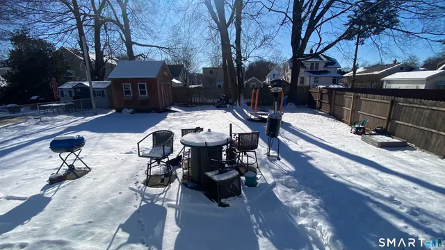 a view of a backyard with sitting area