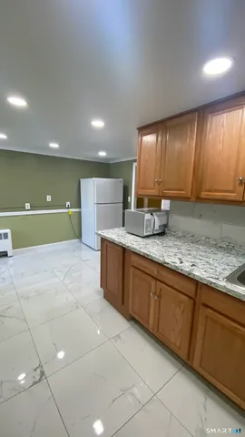 a large bathroom with a sink and a large mirror