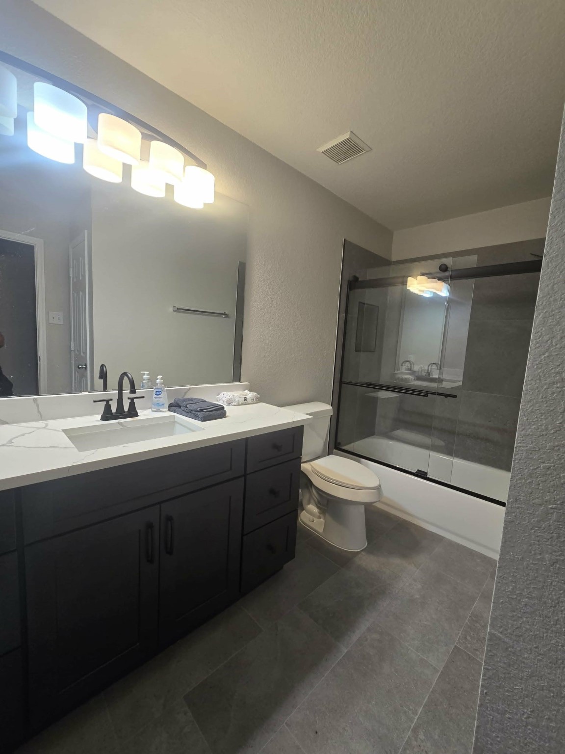 15618 Sweet Maple Court Houston, TX 77049 - Photo 8 of 23 a bathroom with a toilet a sink and mirror